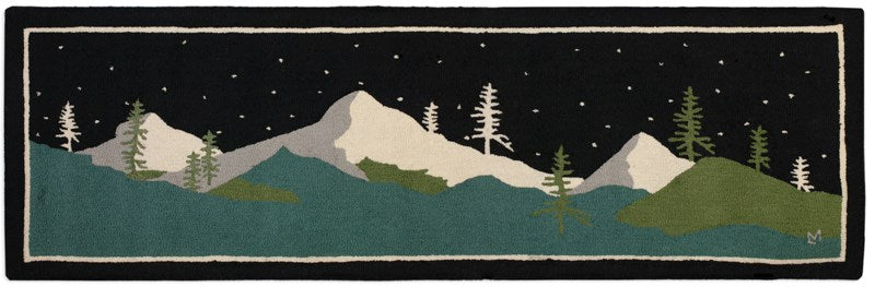 area rug featuring mountain peaks and trees