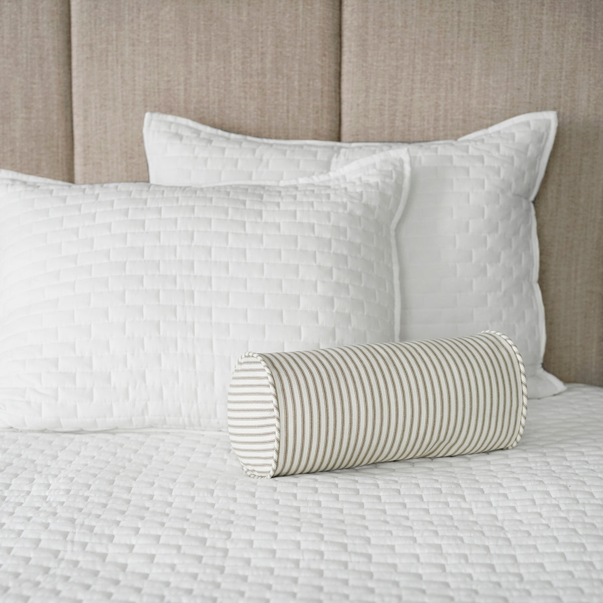 Brown Ticking Stripe Bolster Pillow On Bed